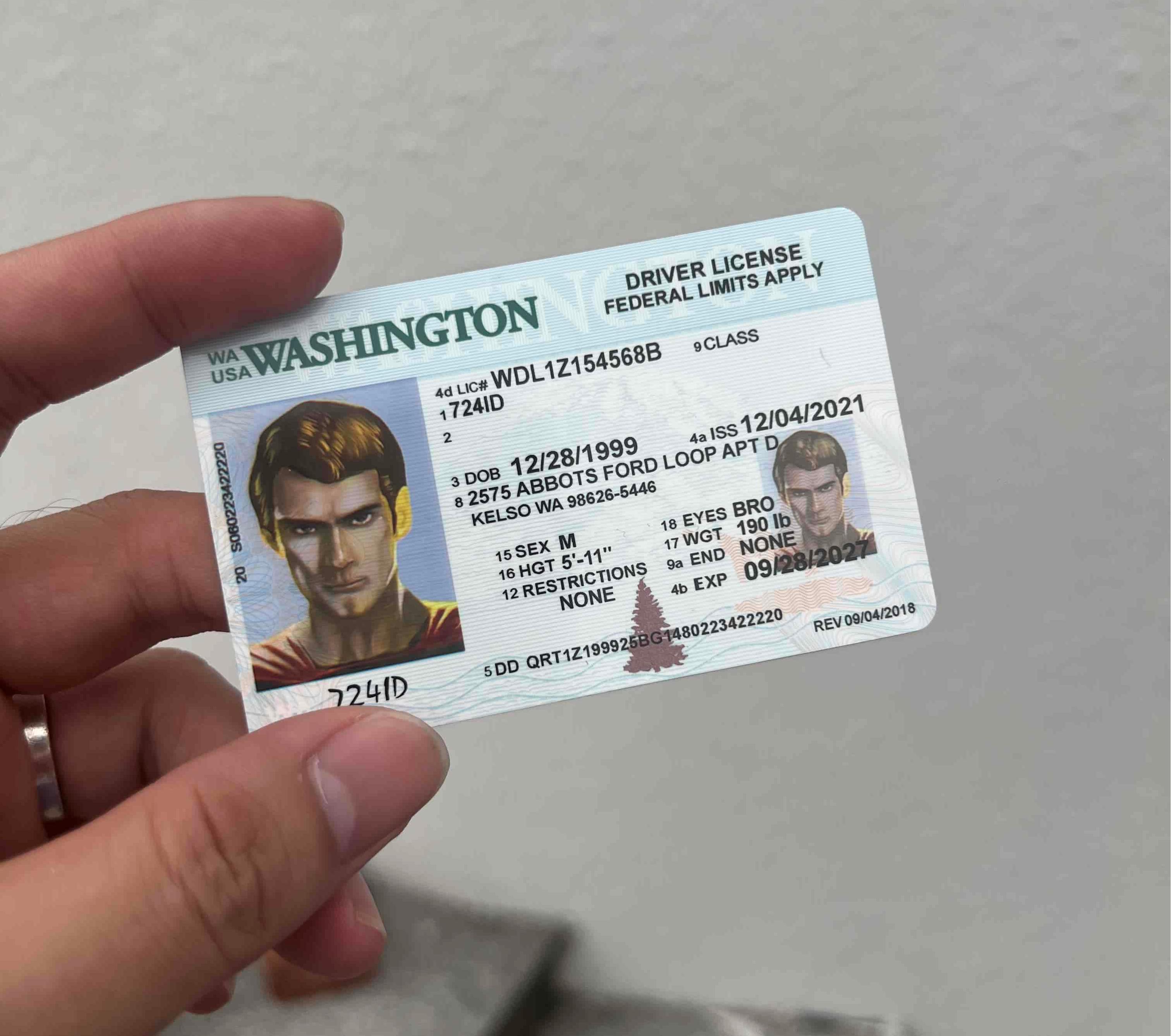 The person holding his driving license in his hands